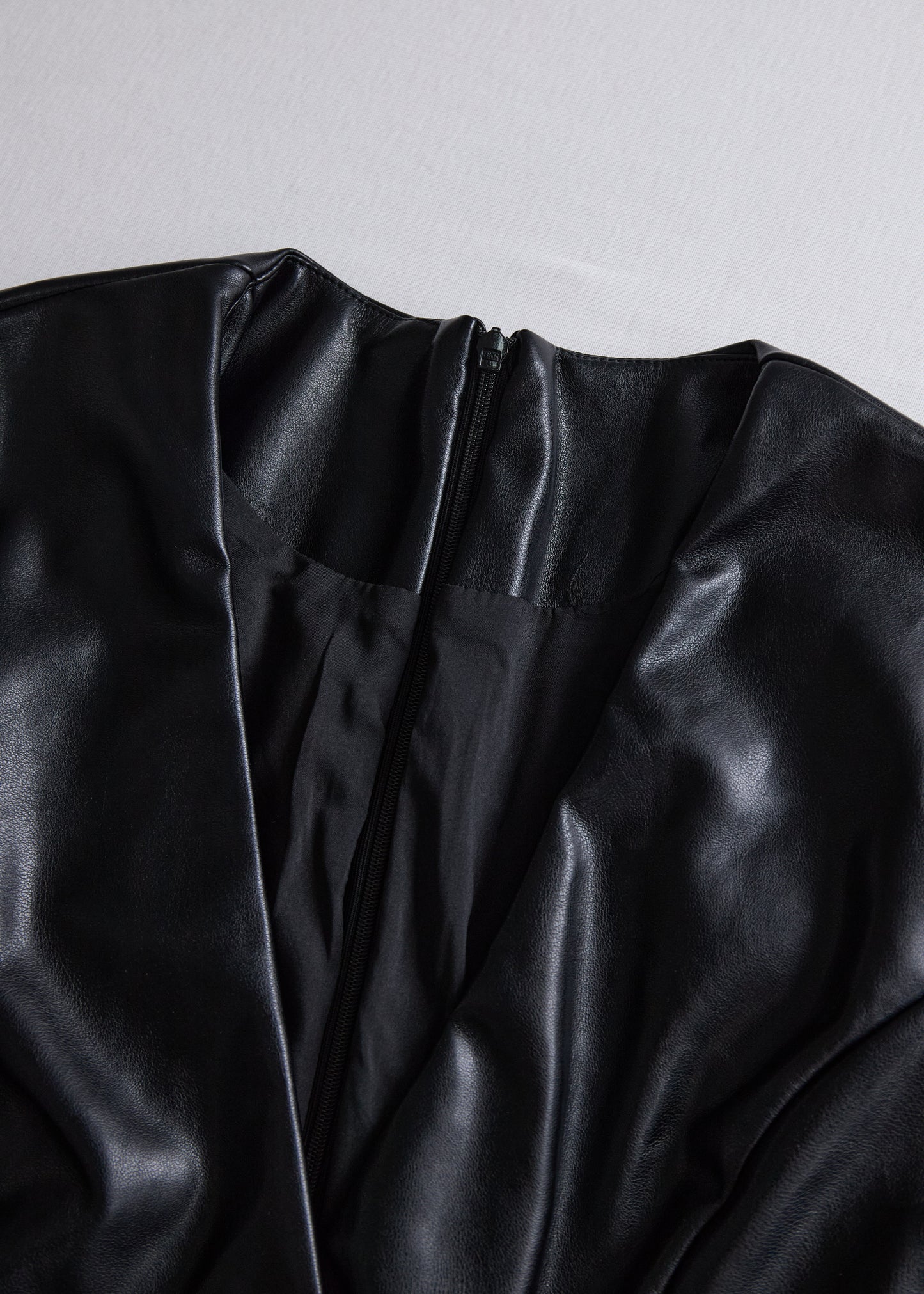 Ceylan Women’s Faux Leather Wrap Mini Dress with V-Neck Silhouette