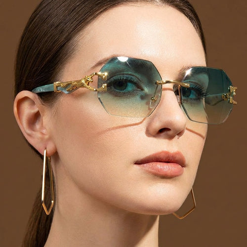 Women’s Rimless Geometric Sunglasses with Sculptural Gold Panther Hardware Detail